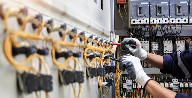 Professional Electrician technician working in Pine Lakes, FL